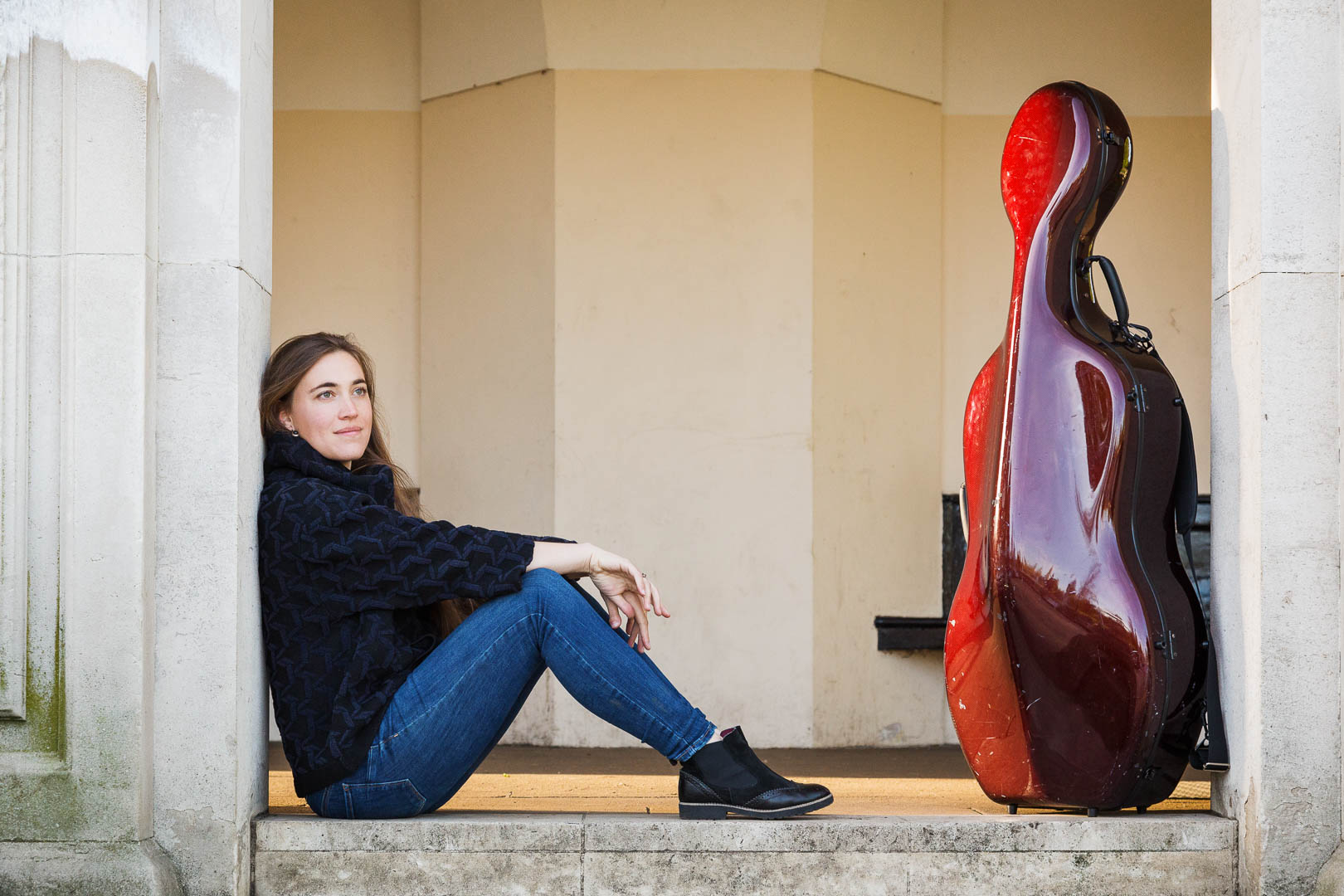 outdoor personal branding photograph of cellist with her stradivarius